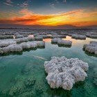 Spectacular sunrise over the salt crystals of the Dead Sea on the Jordanian shores