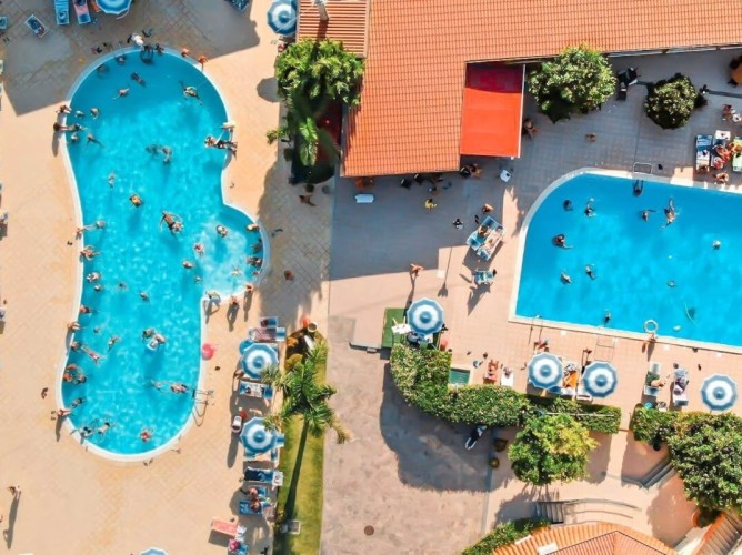 Aquilia Holiday Village Resort - Aerial view of the two pools of the facility.