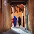 Women strolling through the narrow streets of the Medina of Meknes in Morocco