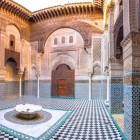 Madrasa Al-Attarine with fountain in Fes, Morocco