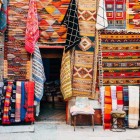 Sale of handmade rugs in the souks of the Medina of Marrakech