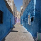 Medina of Casablanca, a narrow alleyway with predominant Moroccan colors