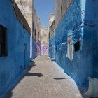 Medina of Casablanca, a narrow alleyway with predominant Moroccan colors