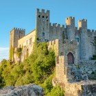 The Castle of Óbidos, dating back to Roman times and listed as a national monument among the 7 wonders of Portugal, was expanded in the 12th century