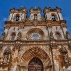 The spectacular facade of the Monastery of Alcobaça, founded in 1153, in the late Portuguese Gothic style known as "Manueline." It is one of the first Portuguese buildings associated with the Cistercian order.