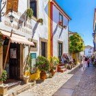 Souvenir shops, chocolates, liquors, and other typical products on the streets of the medieval town of Óbidos