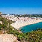 Aerial view of the city of Nazaré, the ocean, and its magnificent beach