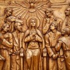 Golden bas-relief of the old Basilica of Fatima representing one of the fourteen mysteries of the rosary, similar to the stations of the cross, the Descent of the Holy Spirit