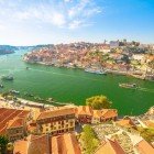 Aerial view of the Dom Luis I Bridge, the Ribeira waterfront, and the Porto skyline from Vila Nova de Gaia, Porto, Portugal