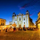 Giraldo Square (Praça do Giraldo), featuring the central marble fountain with eight spouts representing the main streets of Évora, with the Church of Santo Antão, built in 1557 by King Henrique, just behind it