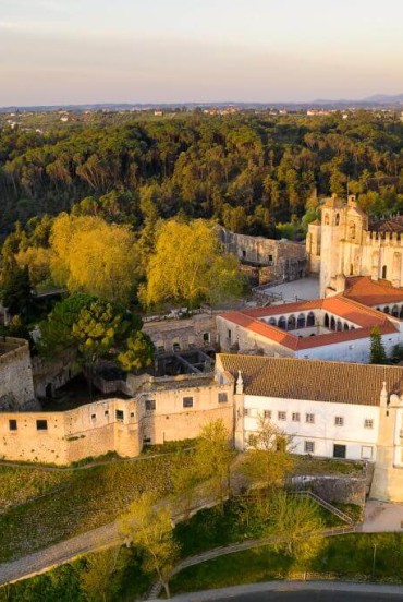 Aerial view of the Convent of Christ and the Templar Castle (UNESCO World Heritage) built on an ancient Roman worship site, reflecting the long history of the West