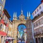 The Arco da Porta Nova is one of the main landmarks in Braga. Designed in Baroque and Neoclassical styles by architect André Soares, it is situated among buildings and commercial shops and marks the western entrance of the city's medieval walls