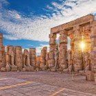 Ancient Luxor Temple, standing statues of Ramses II, ruins of the first pylon, Egypt