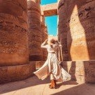 Rows of columns carved with hieroglyphs in the Karnak Temple in the city of Luxor, Egypt