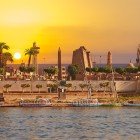 City of Luxor on the banks of the Nile River in Egypt at sunset