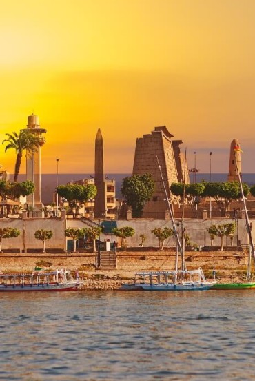 City of Luxor on the banks of the Nile River in Egypt at sunset