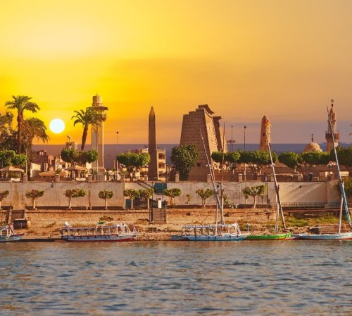 City of Luxor on the banks of the Nile River in Egypt at sunset