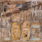 A multi-colored mural from the Karnak temple in Luxor, featuring the vulture goddess and hieroglyphic writing with the cartouches of Thutmose III