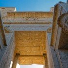 Details of the hieroglyphs on the entrance portal of the Temple of Edfu on the banks of the Nile between Esna and Aswan in Egypt