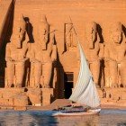 Spectacular view of the façade of the Abu Simbel Temple as seen from a sailboat navigating the Nile River