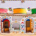 Vibrant colors and geometric patterns of a Nubian house near the temple of Abu Simbel in the Aswan Governorate of Egypt