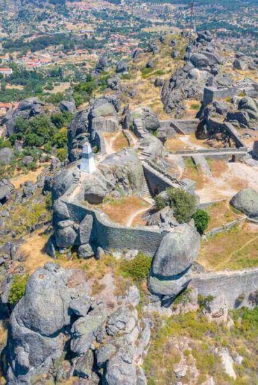 Aerial view of the Monsanto castle, a former freguesia in Portugal in the municipality of Idanha-a-Nova. Kown for its characteristic granite megalithic area and the presence of a fortress once owned by the Templars