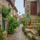 Cobblestone streets and medieval cottages in the village of Monsanto in the Alentejo region of Portugal