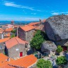 Panorama of Monsanto in the municipality of Idanha-a-Nova in the Alentejo region of Portugal. The area is notable for its megalithic granite landscape and the presence of a fortress once owned by the Templars