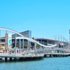 Rambla de Mar and Port Vell in Barcelona; the area features a shopping center called Maremagnum, an IMAX cinema, and an aquarium