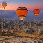 Spectacular hot air balloon flight over Uchisar Castle and the Fairy Chimneys in Cappadocia, Turkey