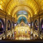 Interiors of the Iron Church of Saint Stephen, highlighting the beautiful golden vaults of the main nave