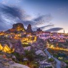 Beautiful twilight view of the ancient town of Uçhisar with its rocky castle in Cappadocia, Turkey