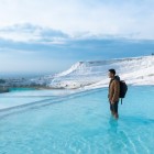 Spectacular view of Pamukkale from one of the many white travertine thermal pools.