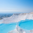 Panoramic view of Pamukkale from the white travertine thermal pools