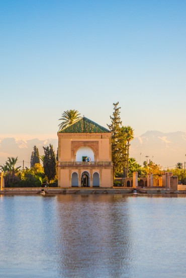 The Menara Gardens in Marrakech offer views of the historic pavilion and the Atlas Mountains, among olive groves and picturesque ponds.